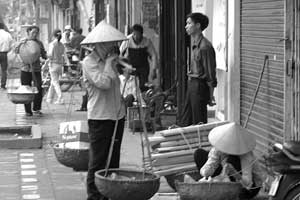 Hanoi street scene by Chuck Kuhn