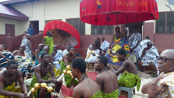 View of the tribal members sitting in front of the king.