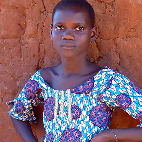 Beautiful little girl in a printed cotton dress