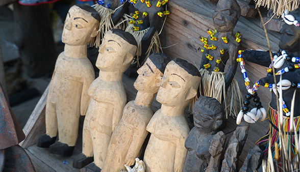 Voodoo dolls lined up in a row.